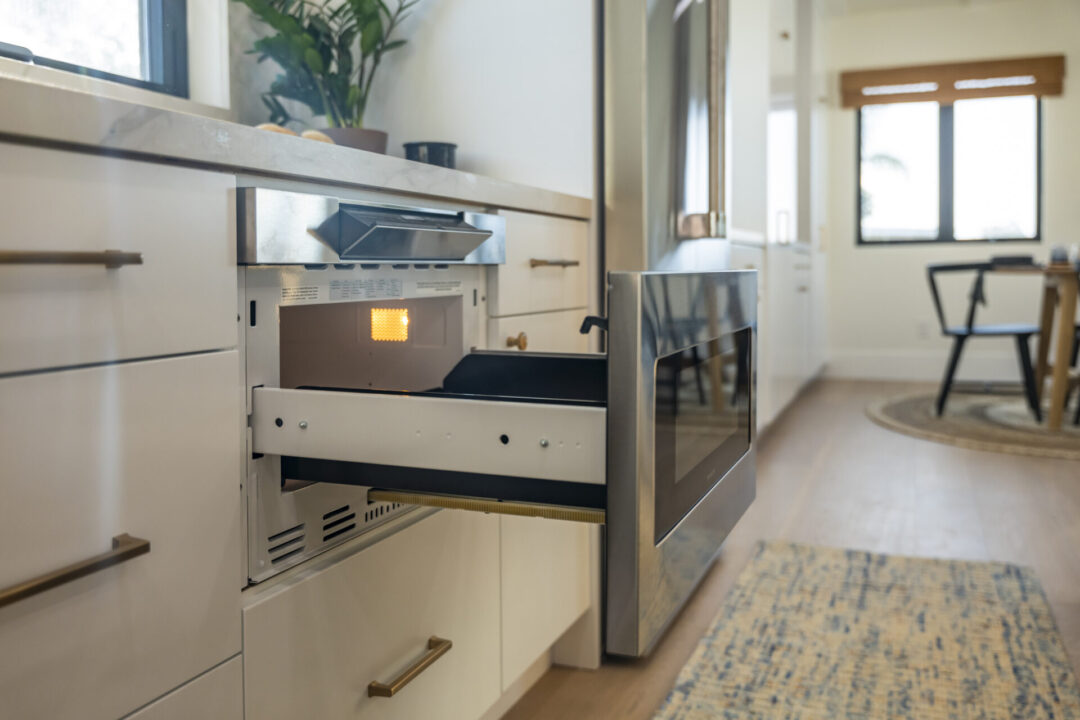 open microwave drawer in kitchen lifestyle image