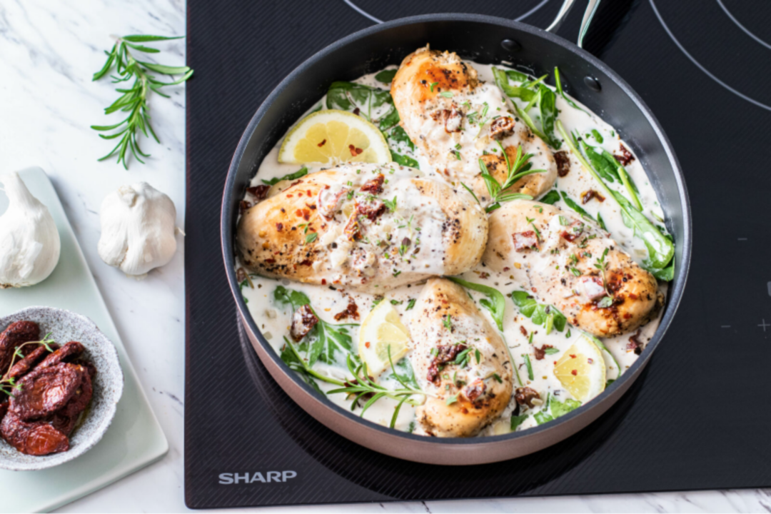 image of Tuscan chicken recipe atop Sharp Induction Cooktop