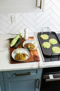 Zucchini and Corn Fritters cooking on a Sharp Induction Cooktop SCh3042GB on the Bridge element