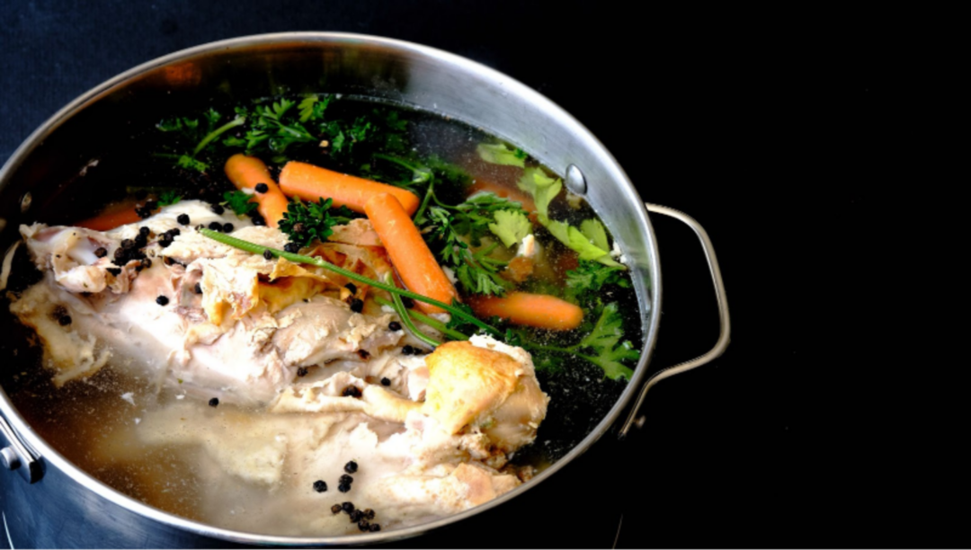 images of a chicken soup recipe cooking on a stove