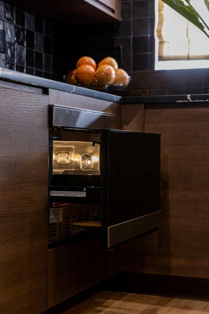 SHARP Microwave Drawer Oven in a dark kitchen featured on Celebrity IOU featuring Julianne & Derek Hough