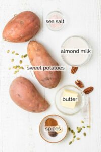 Ingredients for sweet potato casserole on white background