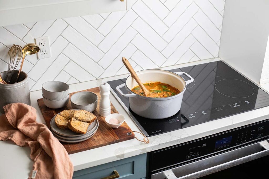 A pot of turkey lentil soup on a Sharp Induction Cooktop (SCH3043GB)