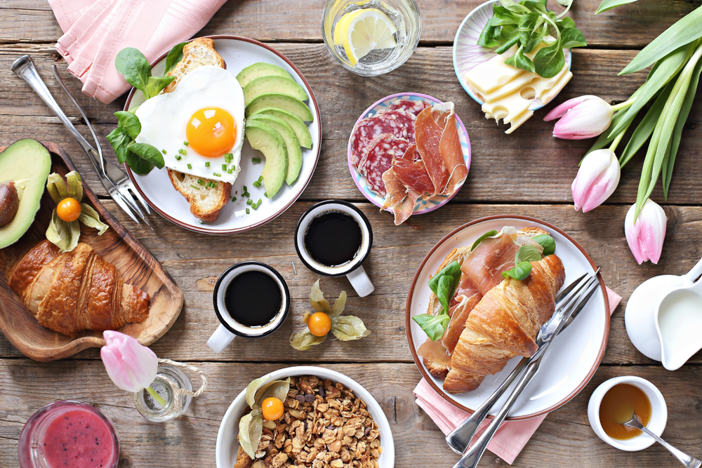 Brunch spread on a table with floral arrangements