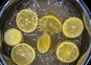 lemon slices boiling in a pot of water
