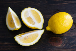 Lemon wedges on a cutting board