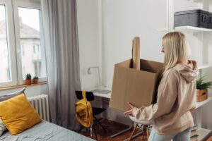 A college student is moving in a dormitory 