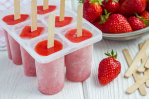 Strawberry ice pops in molds