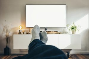 Feet up in front of the screen.