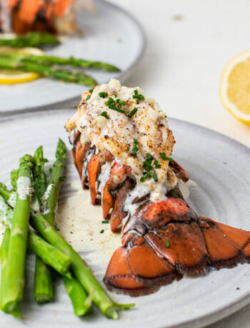 image of a lobster tail on a plate with asparagus